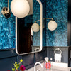 Ocean Seaweed wallpaper in Prussian Blue installed in a bathroom with dark blue wainscoting